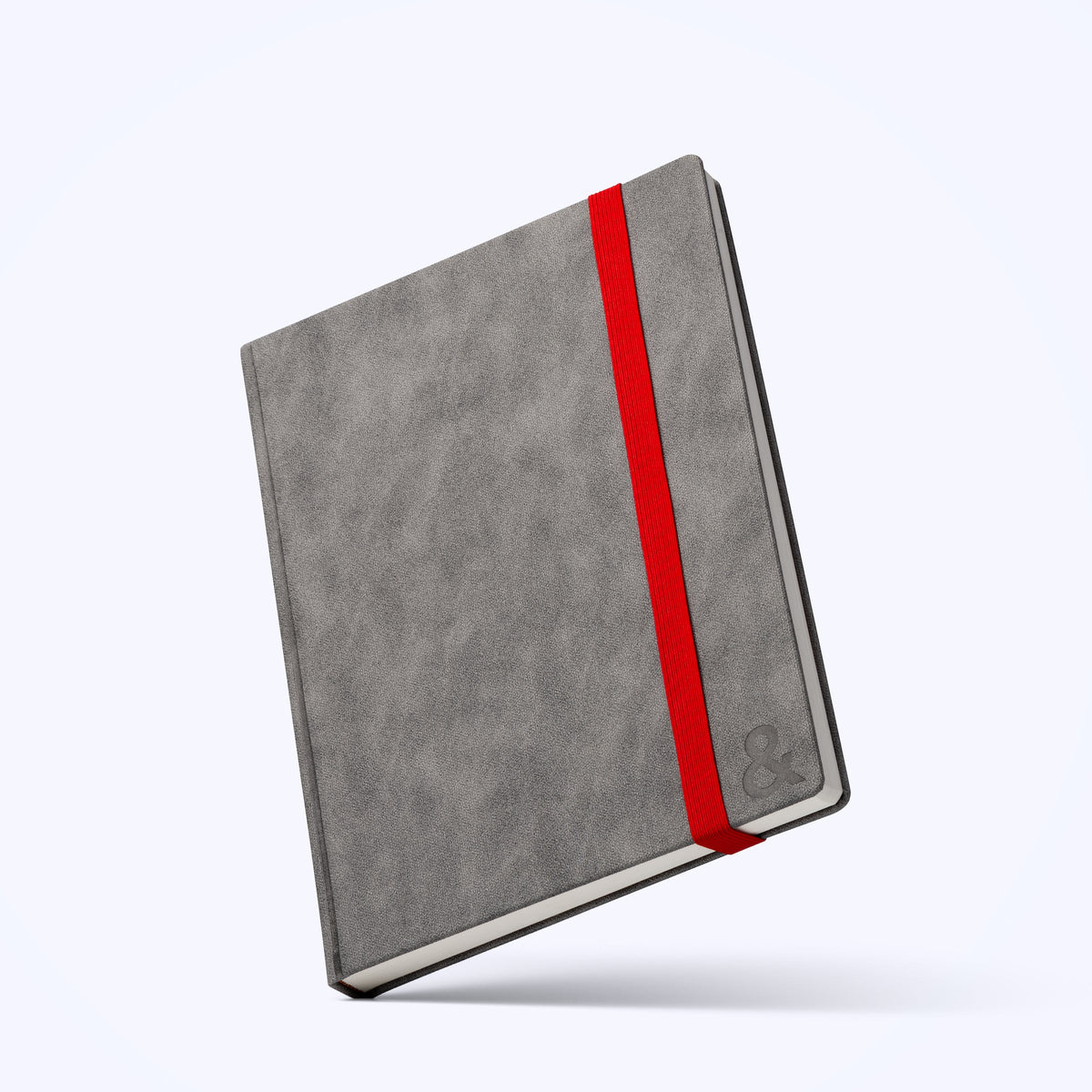 Gray habit system planner angled view with red vertical ribbon and dark spine