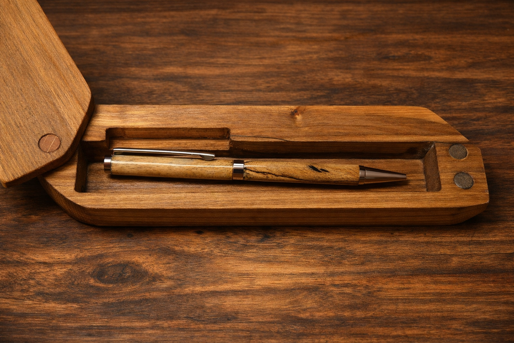 Wood pen and two-part wood lighter with metal ring hardware in wooden base
