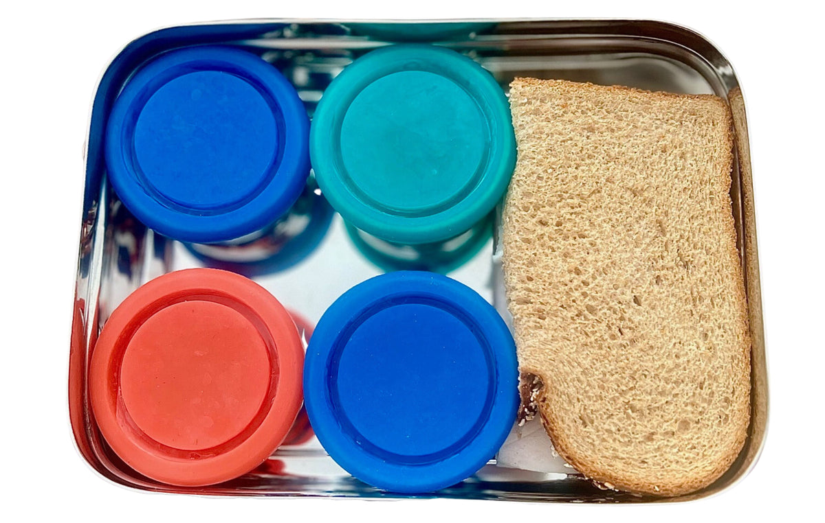 Stainless steel bento tray with two bread slices and colored silicone snap-top lids