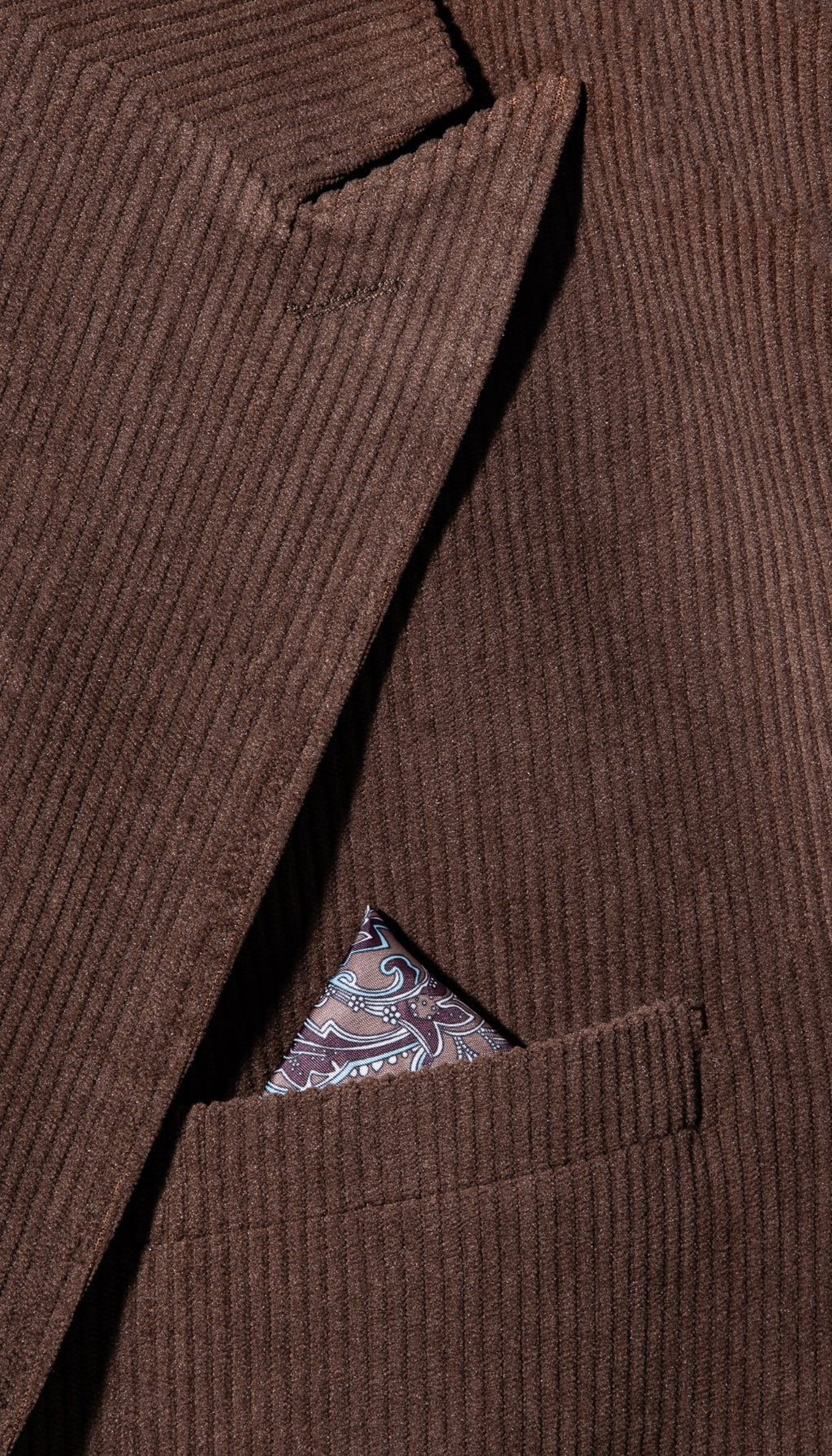 Brown corduroy blazer with chest pocket and paisley-trimmed pocket square