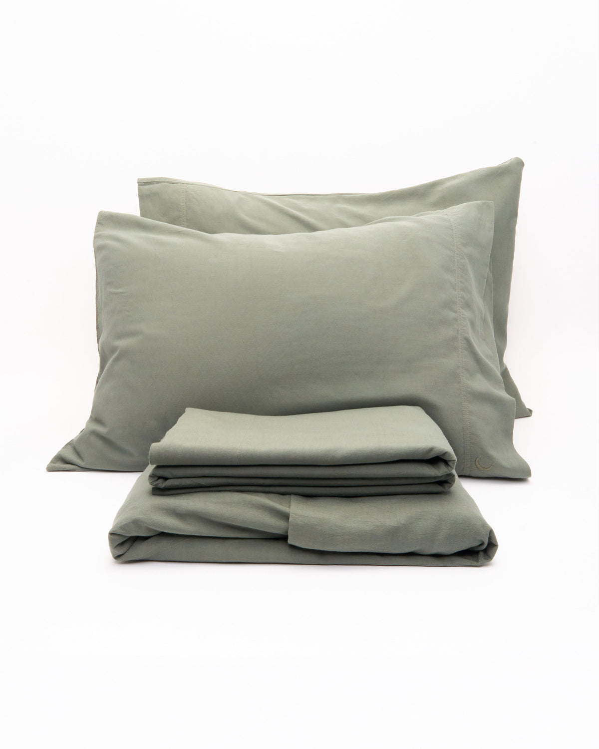Sage green bed sheet set with two pillowcases and folded sheets