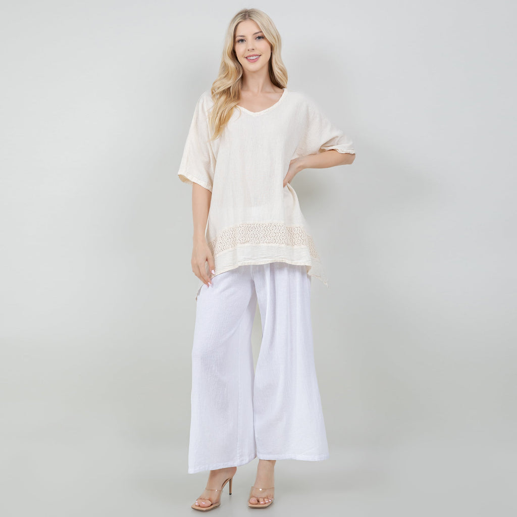 White cotton gauze top with scoop neck and embroidered hem detail