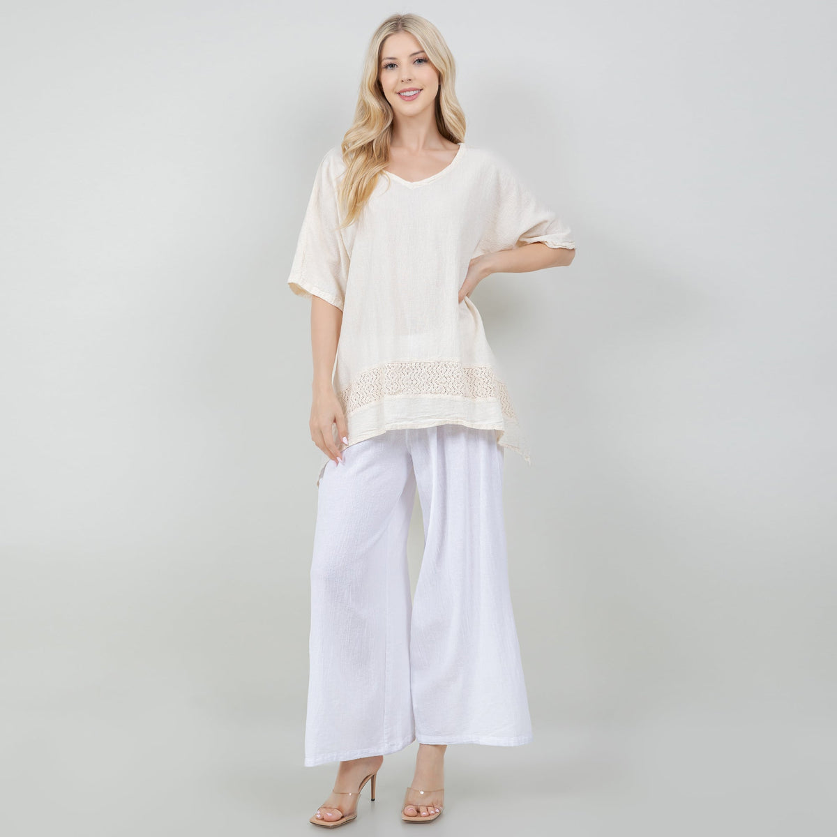 White cotton gauze top with scoop neck and embroidered hem detail