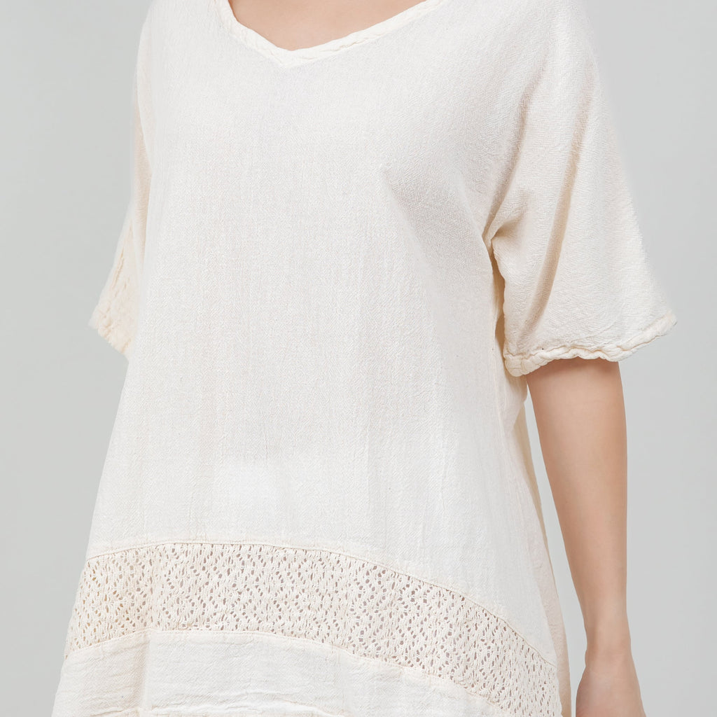 White cotton gauze Cynthia top close-up: scoop neckline and embroidered hem band