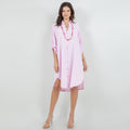 Pink cotton gauze tunic with collar, button-front placket, and side slits