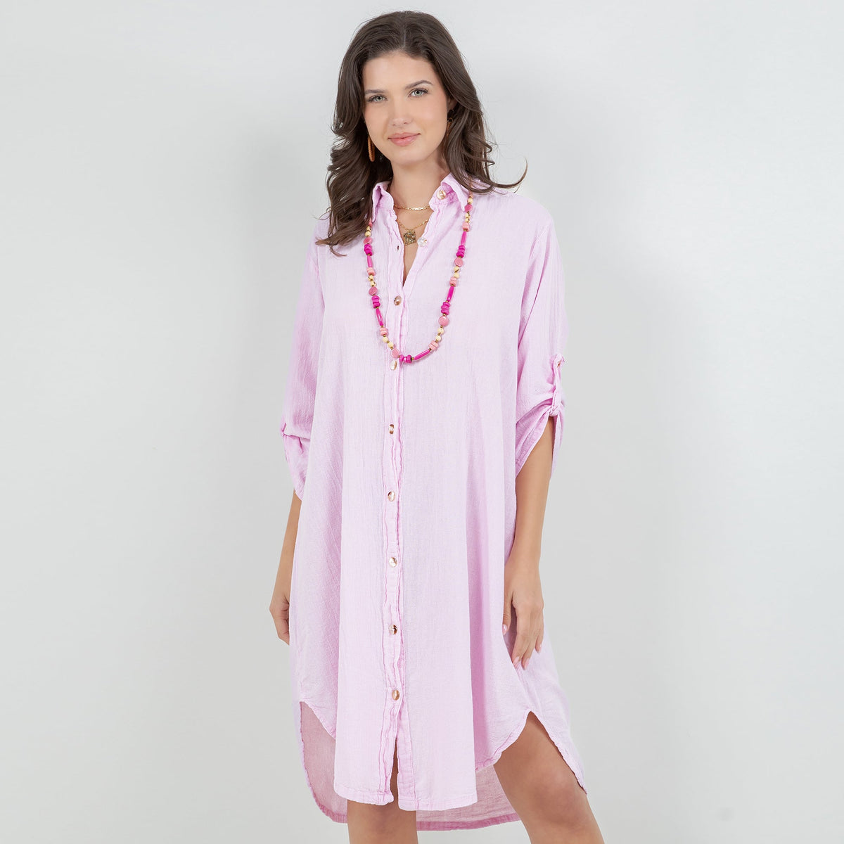 Women’s cotton gauze tunic in light pink, button-front, 3/4 sleeves, side slit hem.