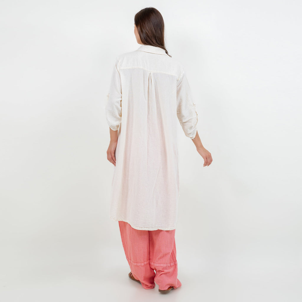 Women’s cotton gauze tunic, button-front, long sleeves, back view, side slits.