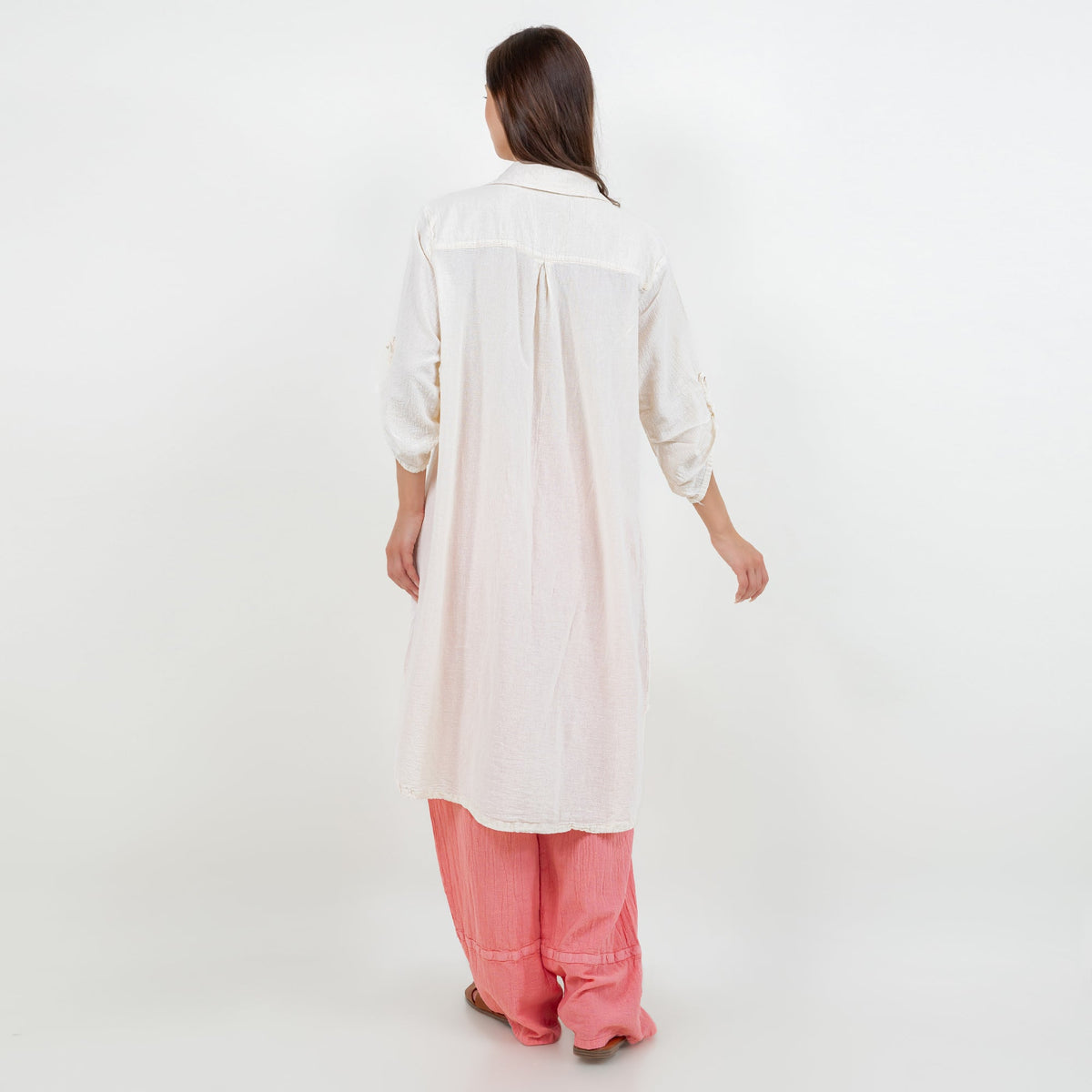 Women’s cotton gauze tunic, button-front, long sleeves, back view, side slits.