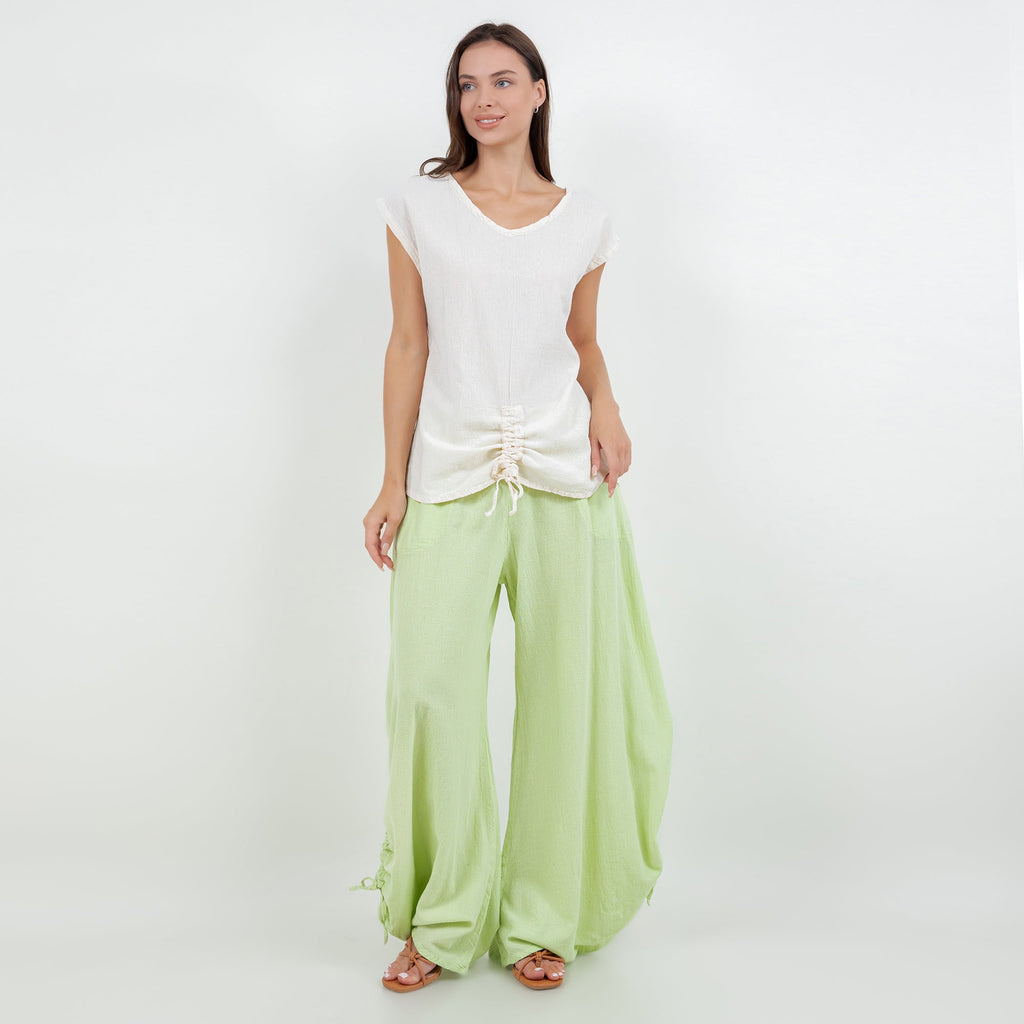 Light green cotton gauze wide-leg pants with elastic waistband and tied side hems