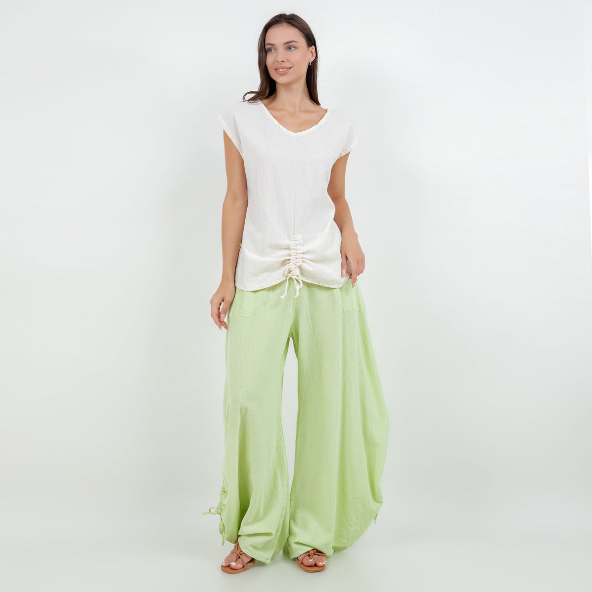 Light green cotton gauze wide-leg pants with elastic waistband and tied side hems
