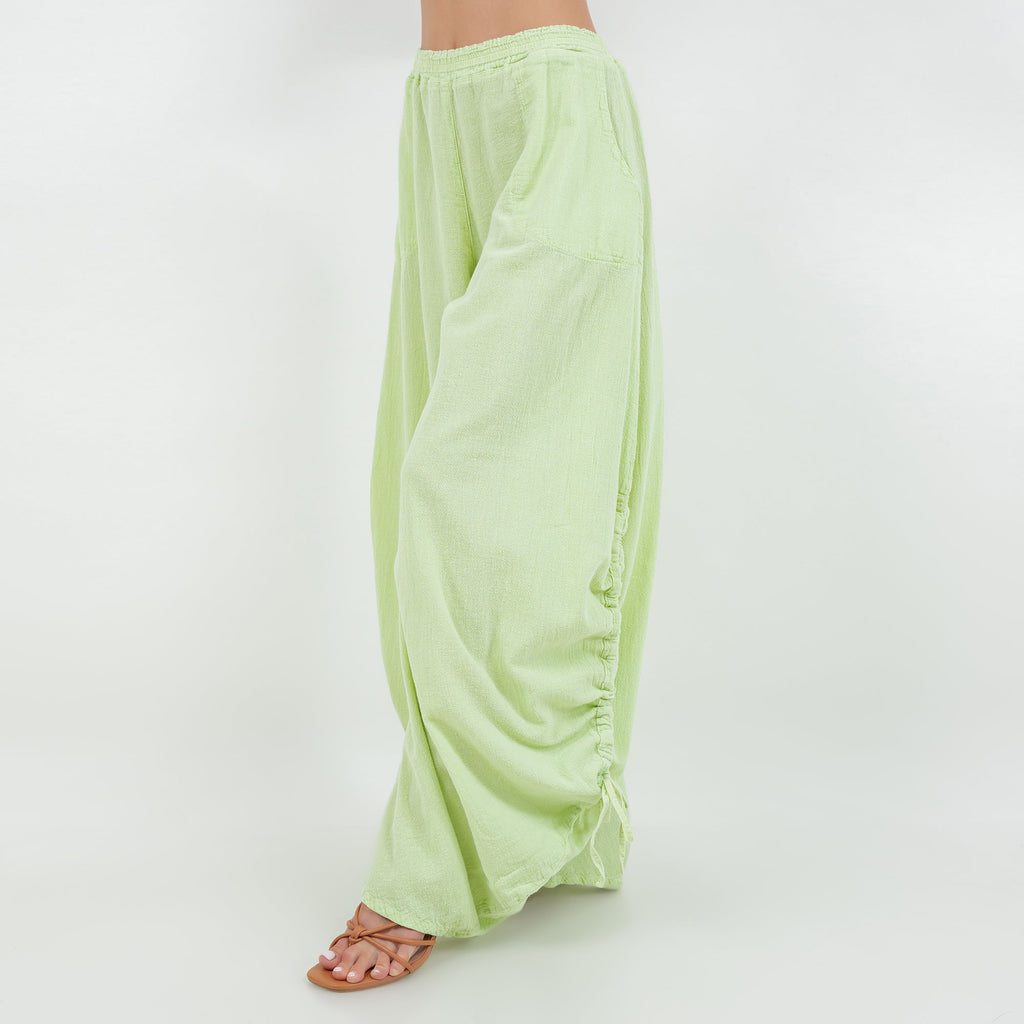 Lime green cotton gauze pants with elastic waist and drawstring, loose wide legs