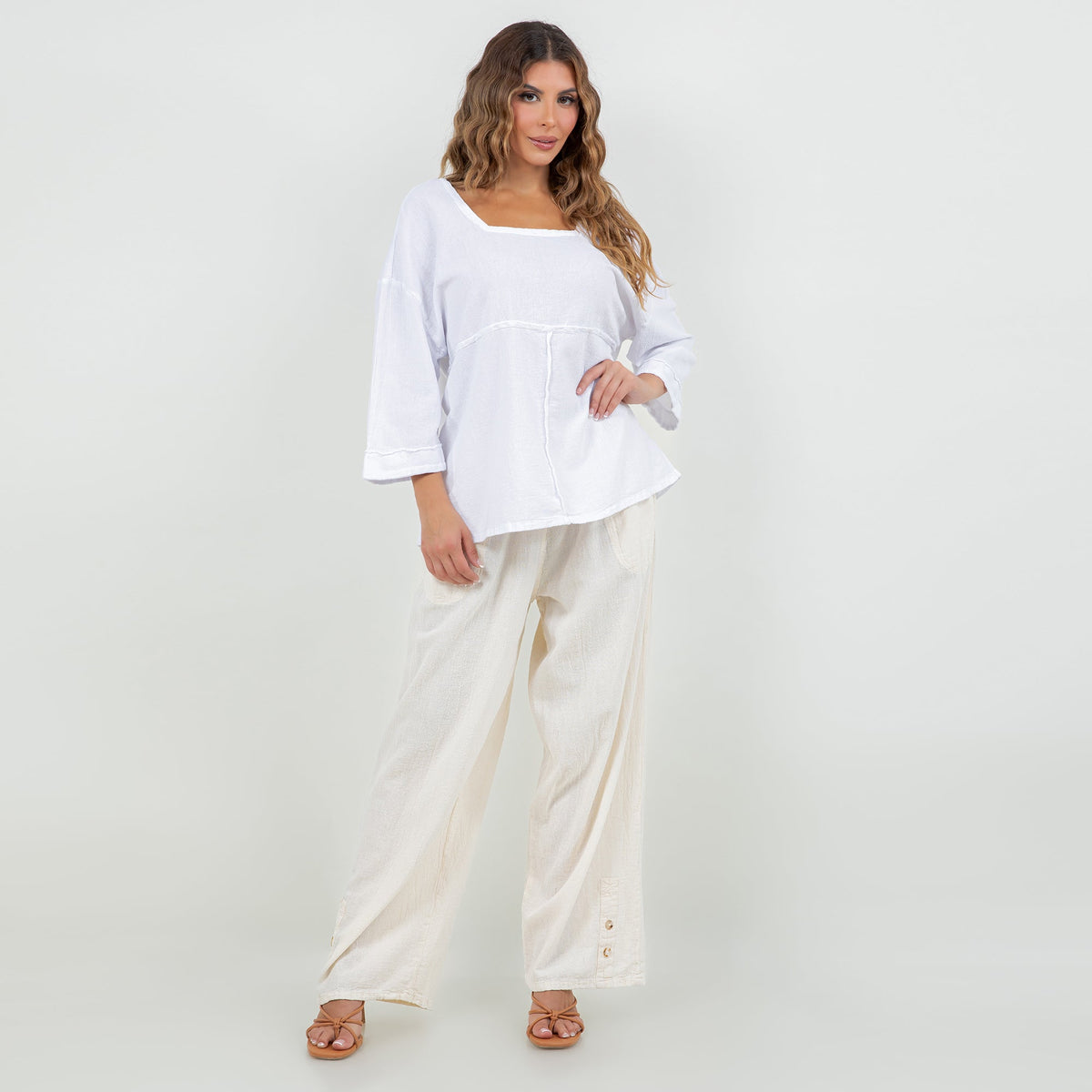 White cotton gauze peasant top with square neckline and curved hem, 3/4 sleeves