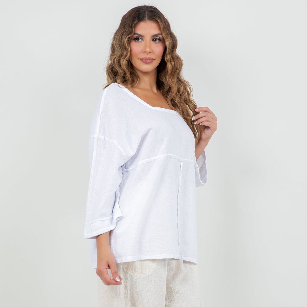 White cotton gauze top with square neckline, loose fit, and three-quarter sleeves