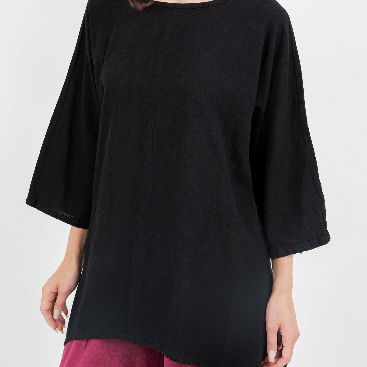 Women's cotton gauze top, black, close-up of drapey fabric and wide three-quarter sleeves