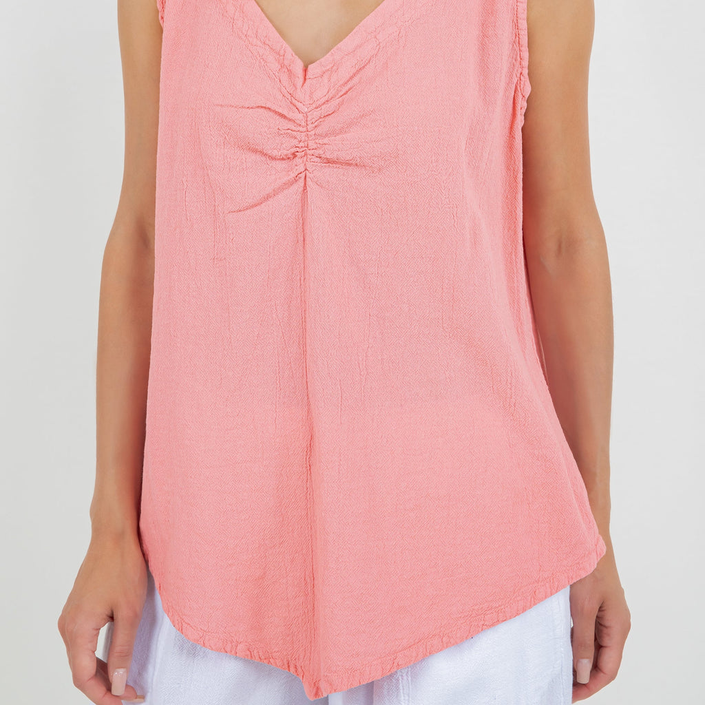 Women’s coral pink cotton gauze tank top, close-up of V-neck ruched center