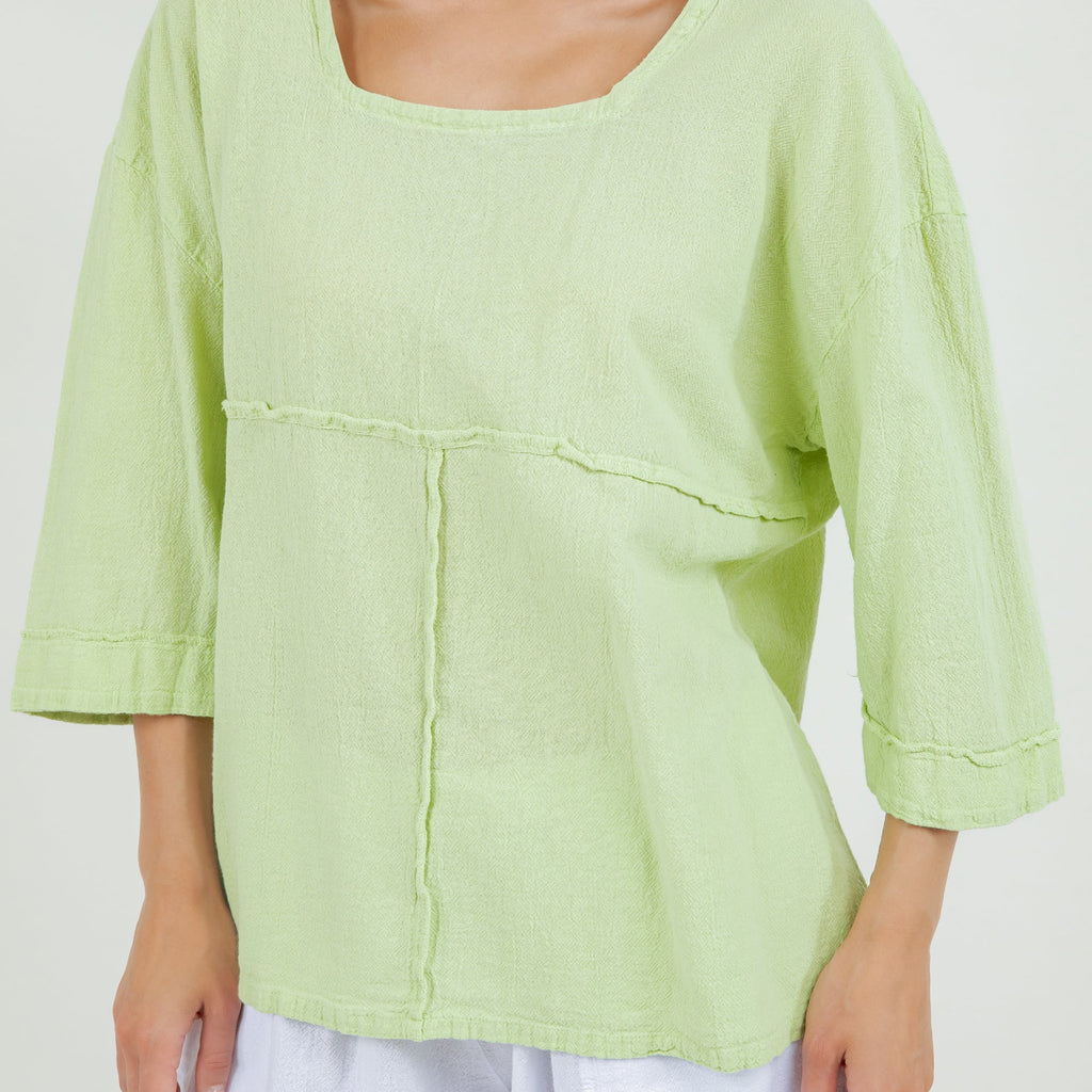 Lime green cotton gauze peasant top front detail with yoke panel and stitched seams