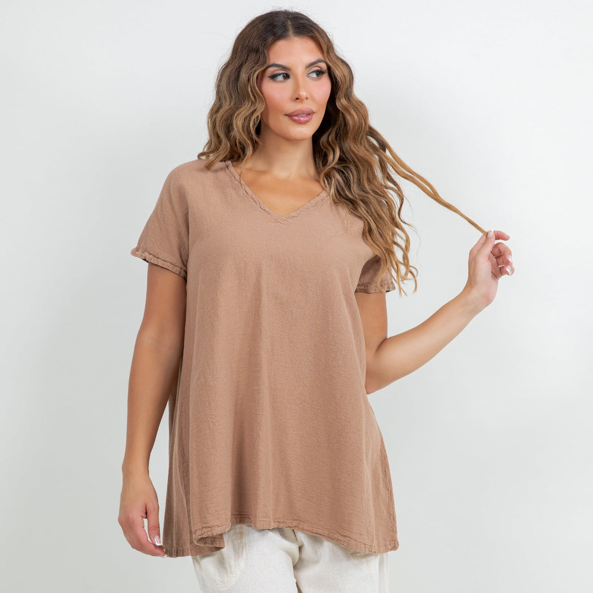 Brown cotton gauze tunic top with V-neck, short sleeves, and slightly curved hem