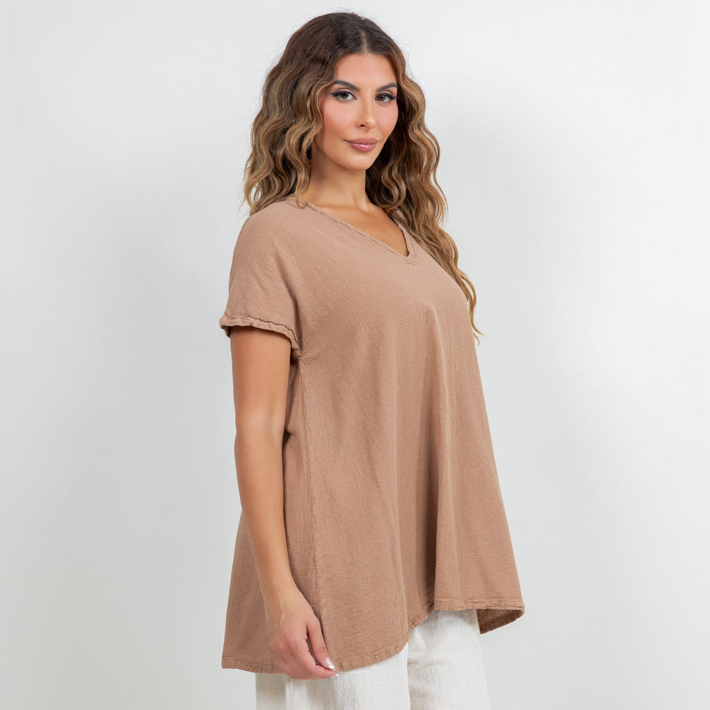 Brown cotton gauze top with V-neck and short sleeves, drapey fit over pants