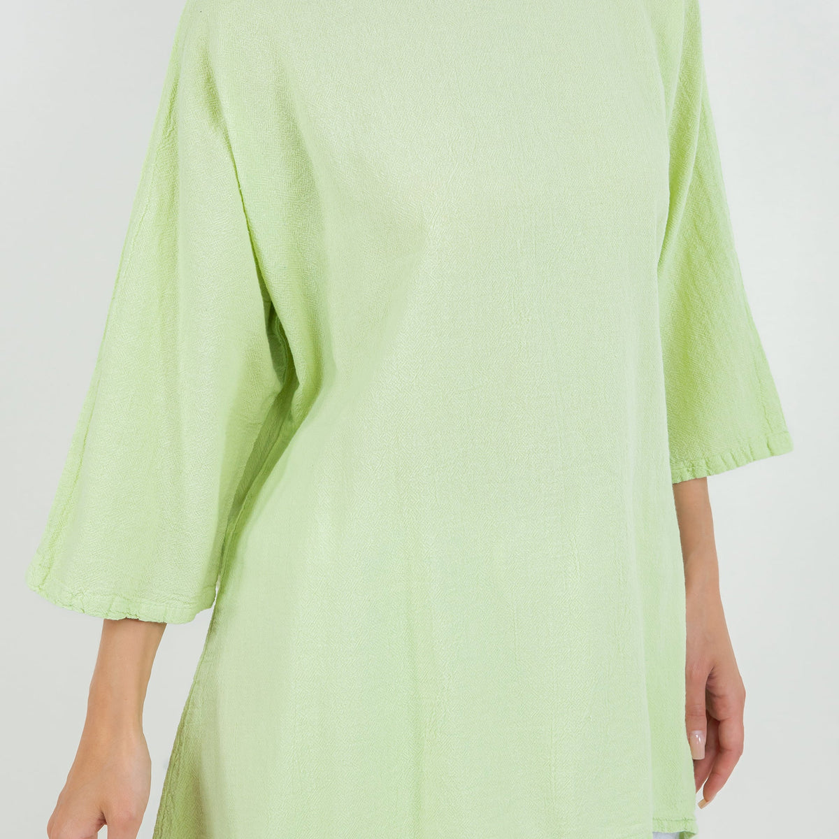 Women's cotton gauze Angela top in light green, fabric close-up with three-quarter sleeve