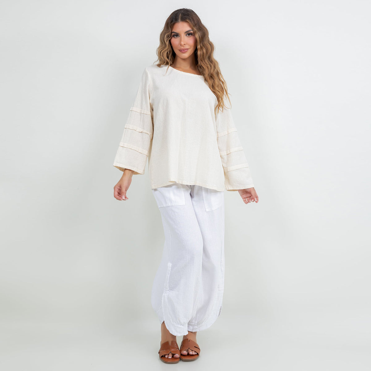 Off-white cotton gauze sabrina top with bateau neckline and tiered 3/4 sleeves