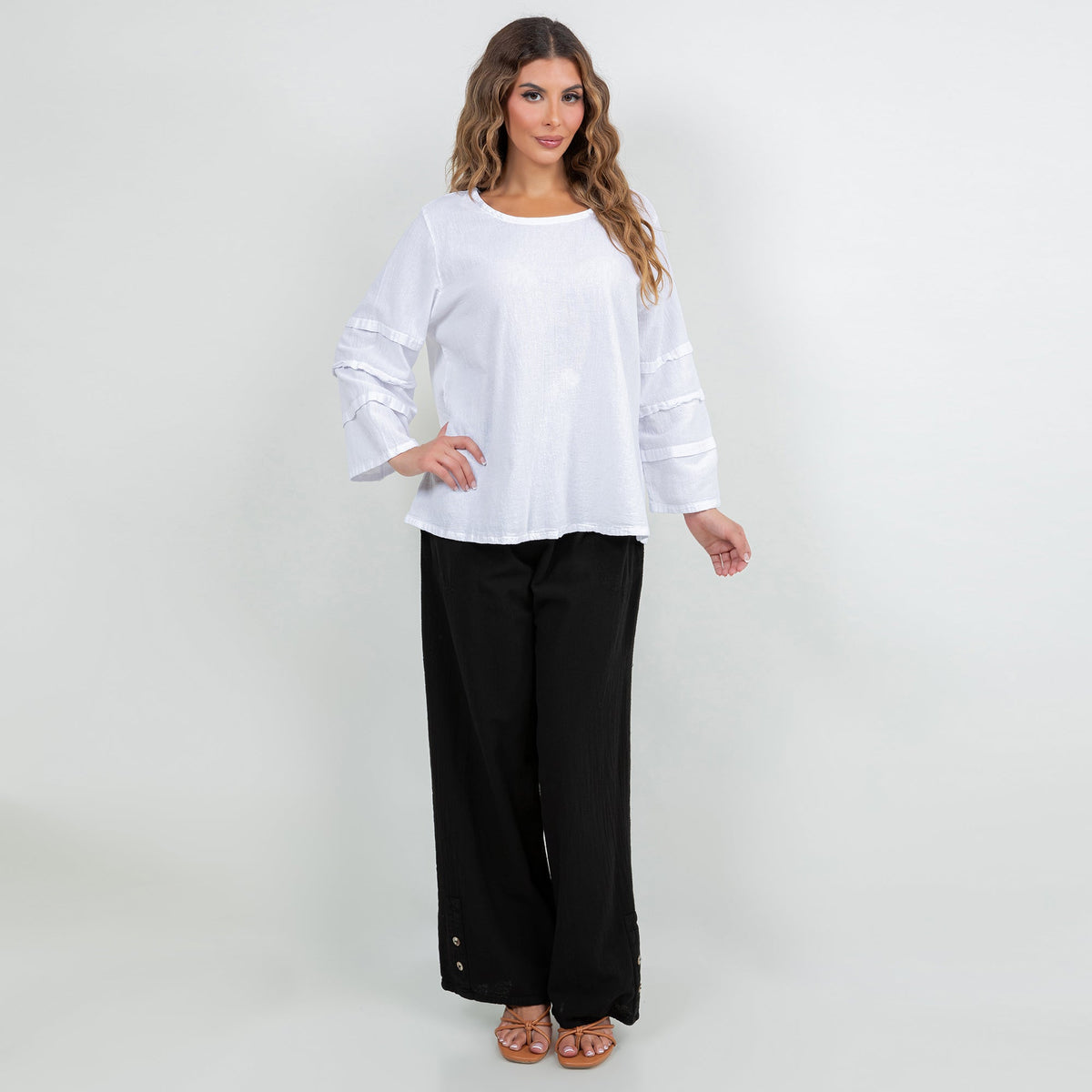 White cotton gauze sabrina top worn with black pants; three-quarter banded elastic sleeves