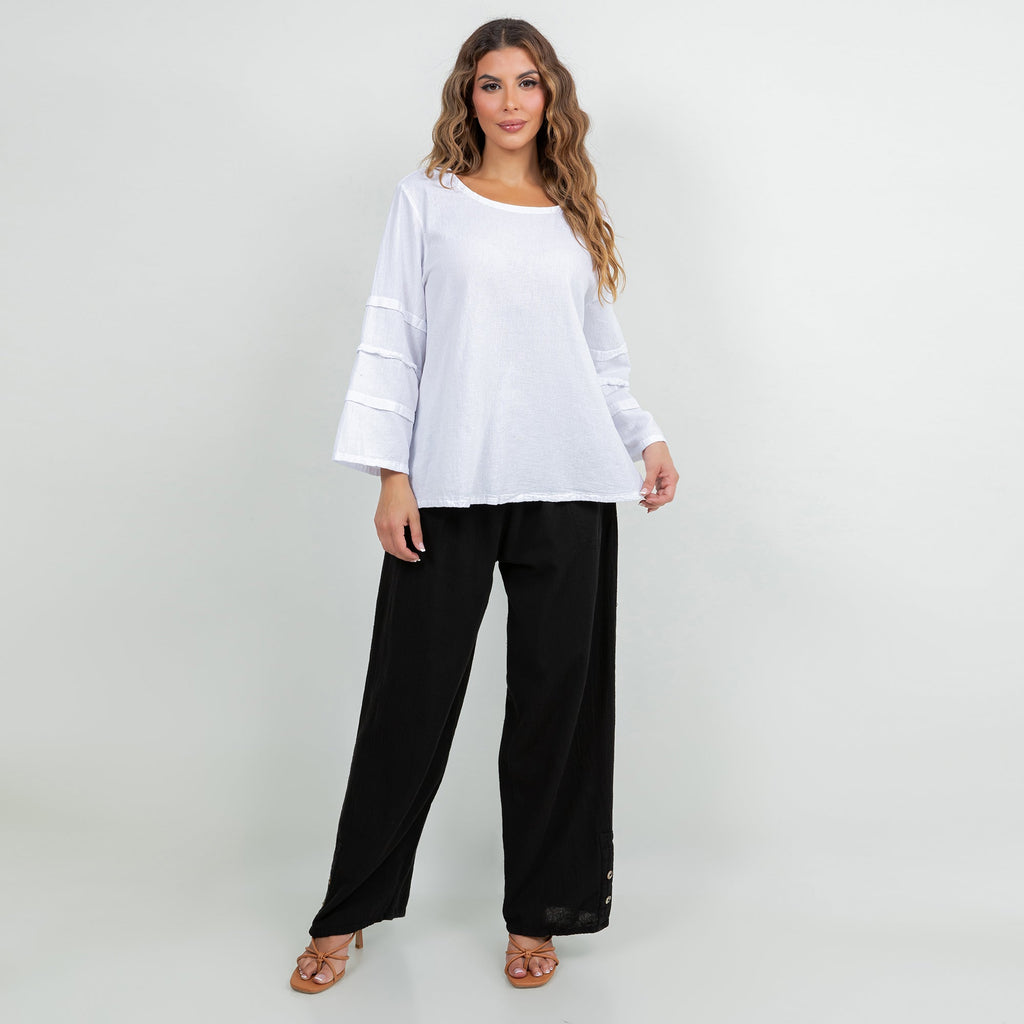 White cotton gauze sabrina top with three-quarter banded elastic sleeves and black pants