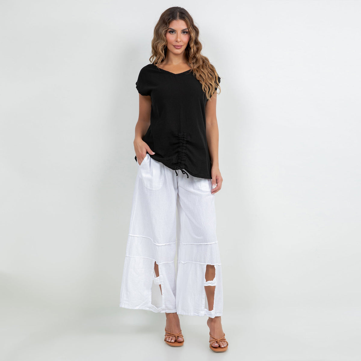 Black cotton gauze Camie top with V-neck and short sleeves, ruched drawstring hem