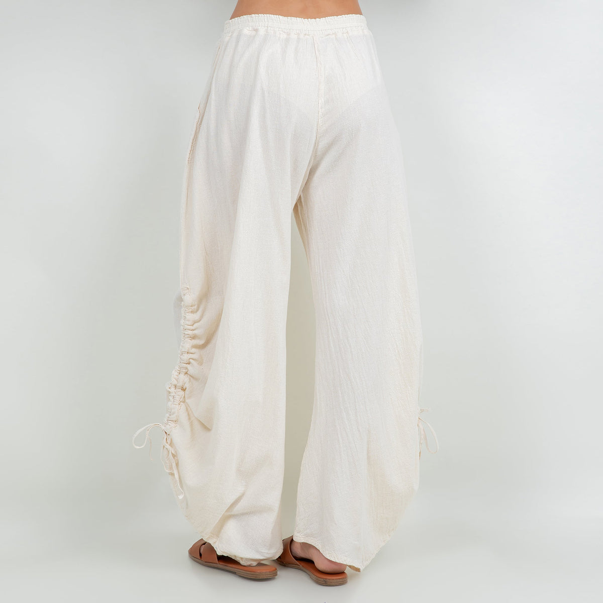 Ivory cotton gauze wide-leg pants with elastic waist and side ruching with ties
