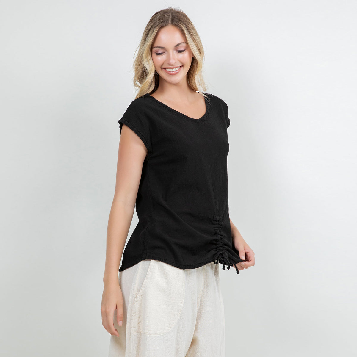 Black cotton gauze Camie top with V-neck and short sleeves, ruched drawstring hem