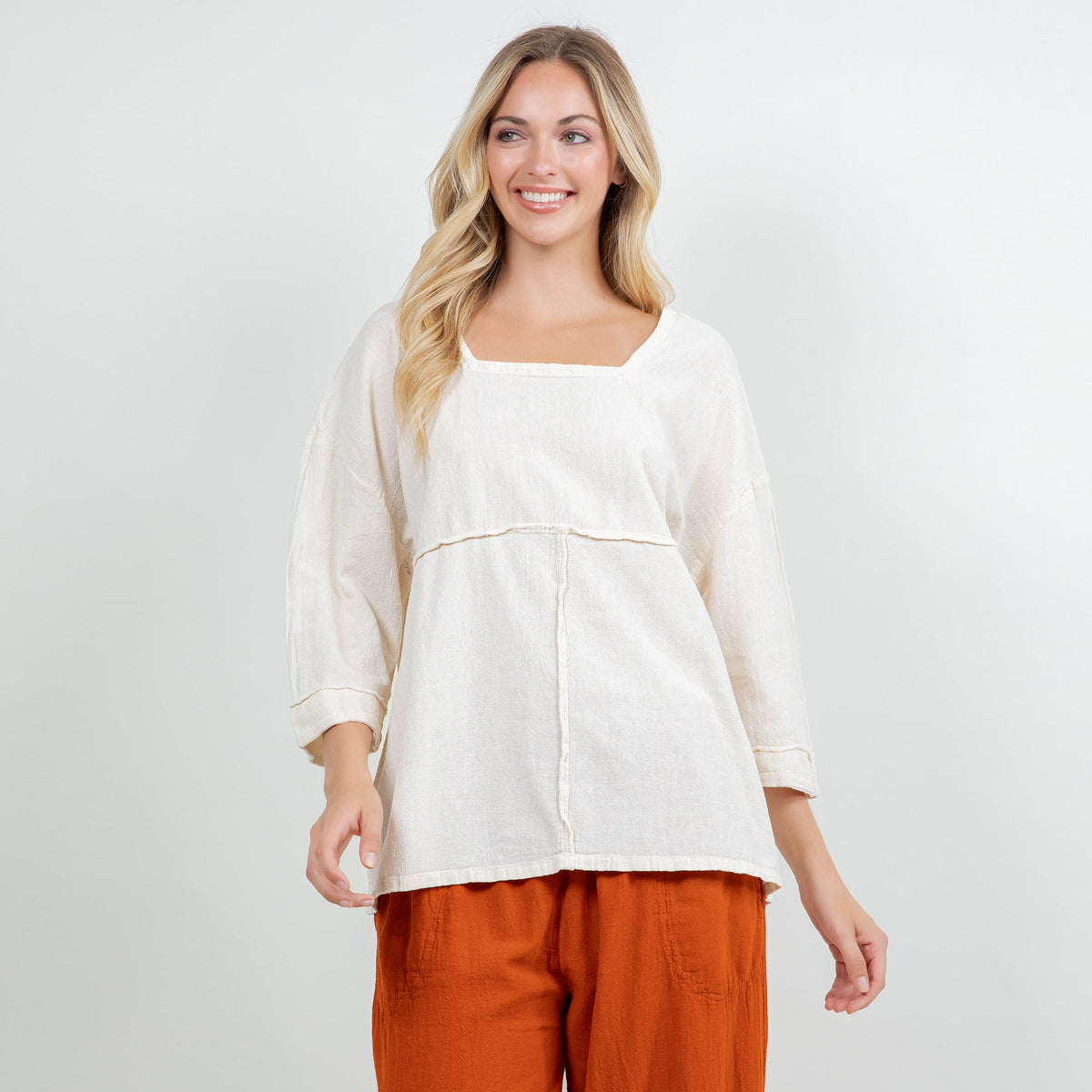 Ivory cotton gauze top with square neckline, 3/4 sleeves, and yoke seam detail