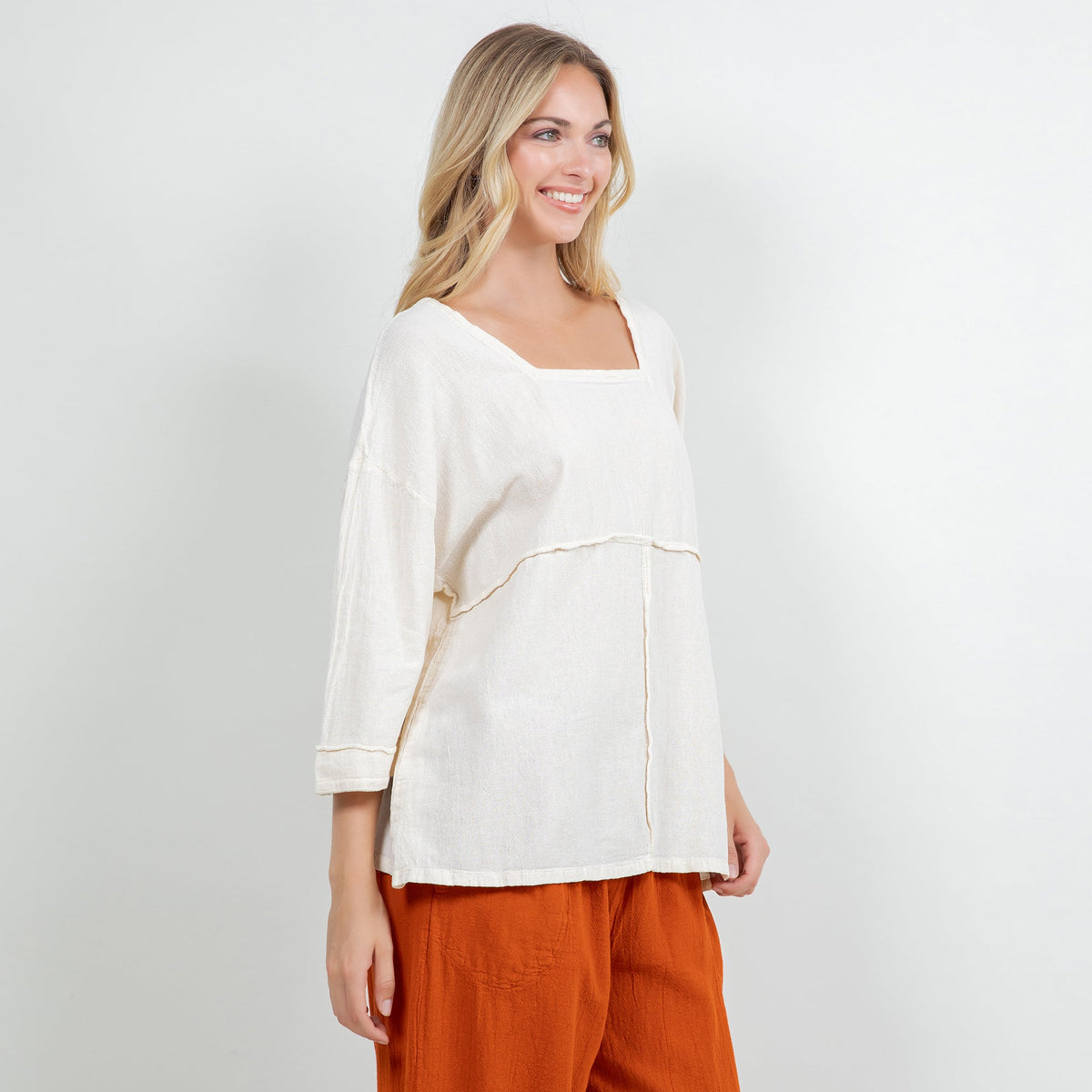 White cotton gauze peasant top with square neckline and three-quarter sleeves