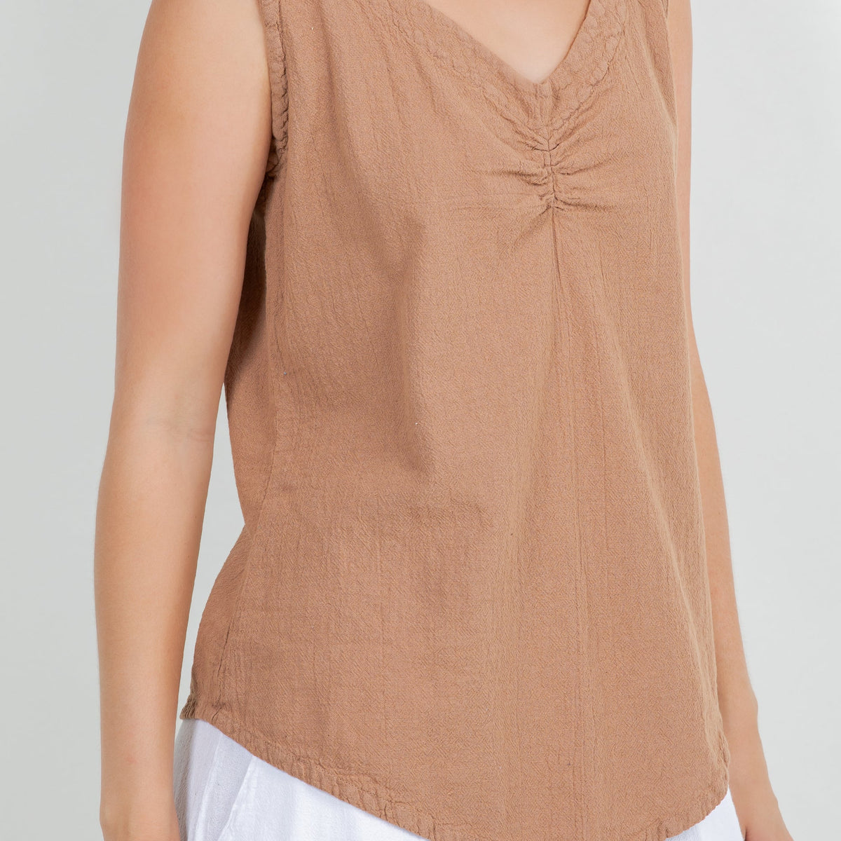 Women’s cotton gauze tank top close-up, warm brown V-neck with gathered seam