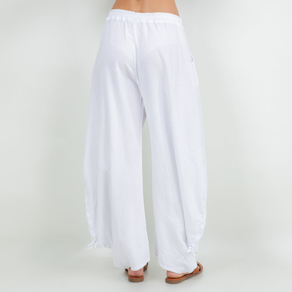White cotton gauze wide-leg pants with elastic waistband and tassel tie details