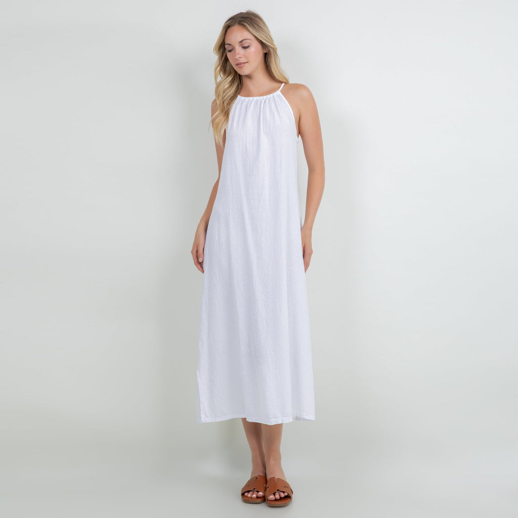 White cotton gauze sleeveless halter midi dress with gathered neckline and slit hem.
