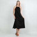 Black cotton gauze halter midi dress with gathered neckline and sleeveless silhouette.