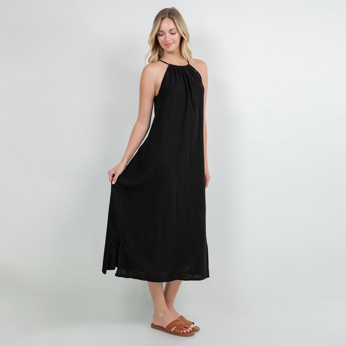 Black cotton gauze halter neck midi dress with gathered neckline and flared skirt.
