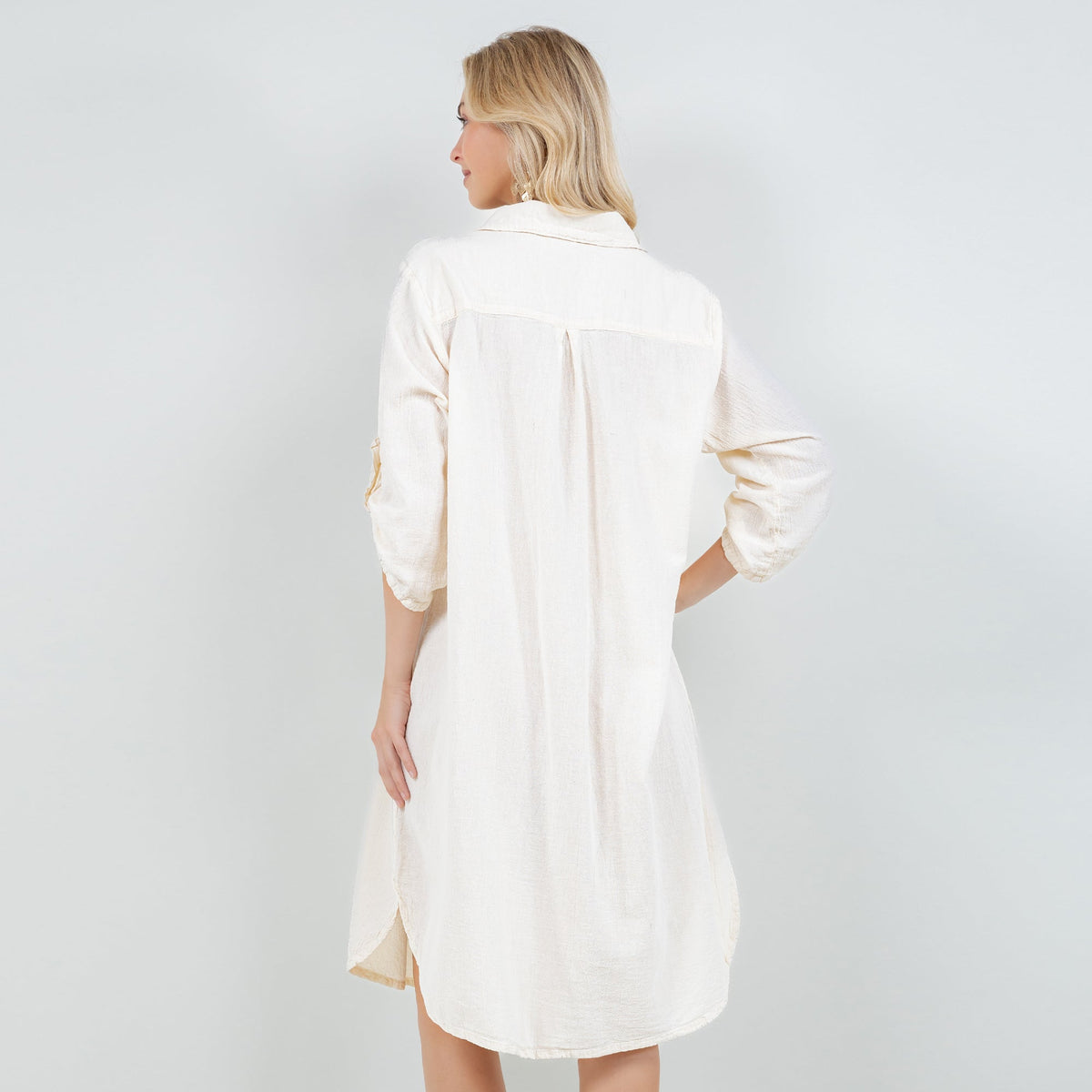 Ivory cotton gauze tunic shown from back with collar and side-slit hem