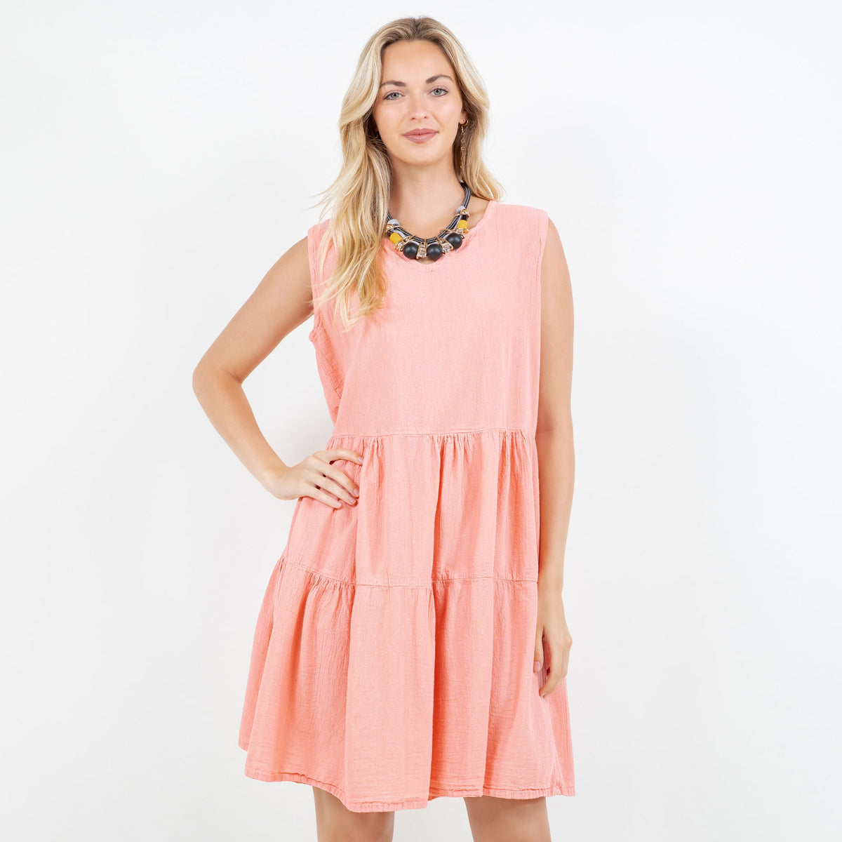 Peach pink cotton gauze tiered sleeveless mini dress with gathered waist