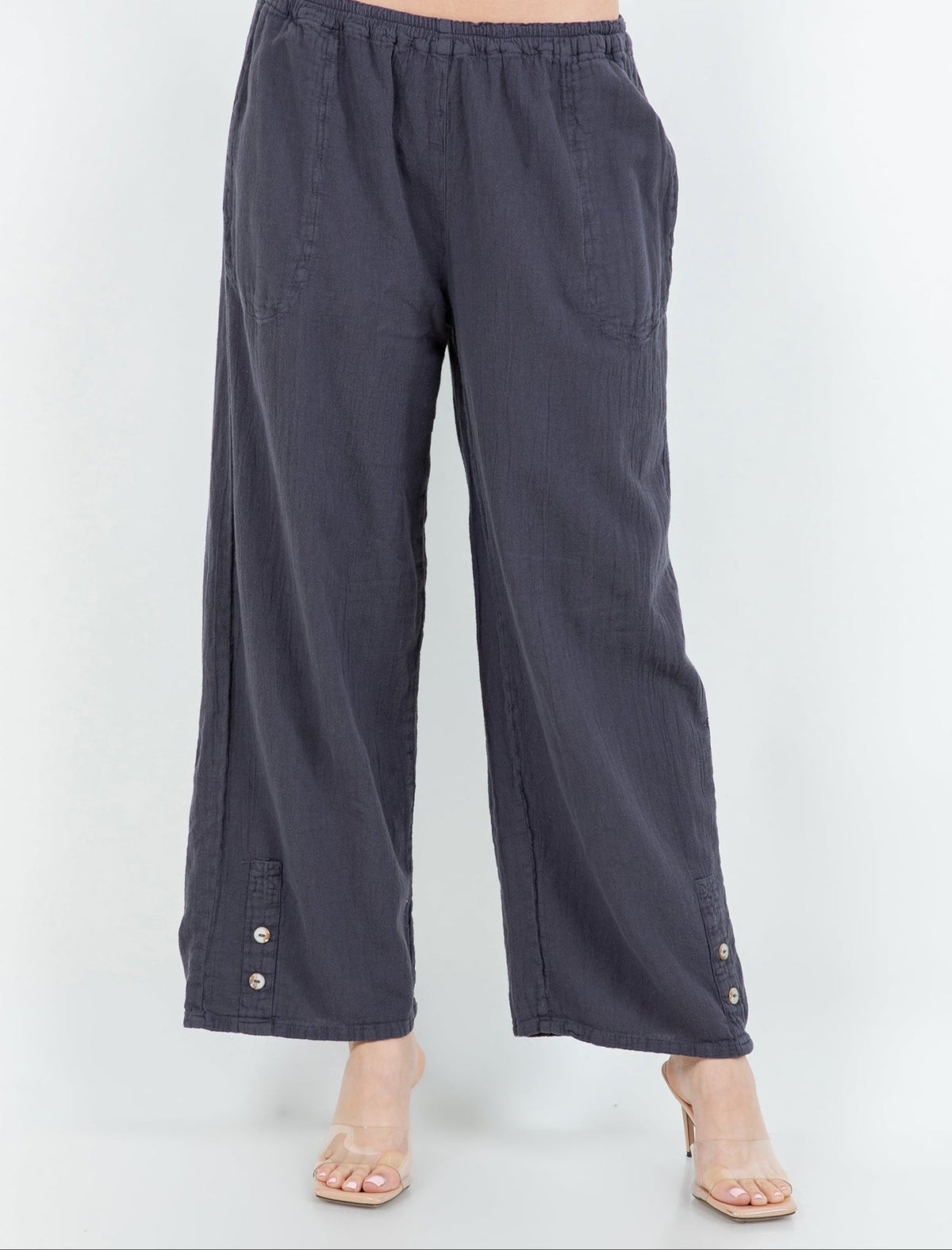 Charcoal cotton gauze pants with elastic waist, roomy wide-leg fit, and button cuffs