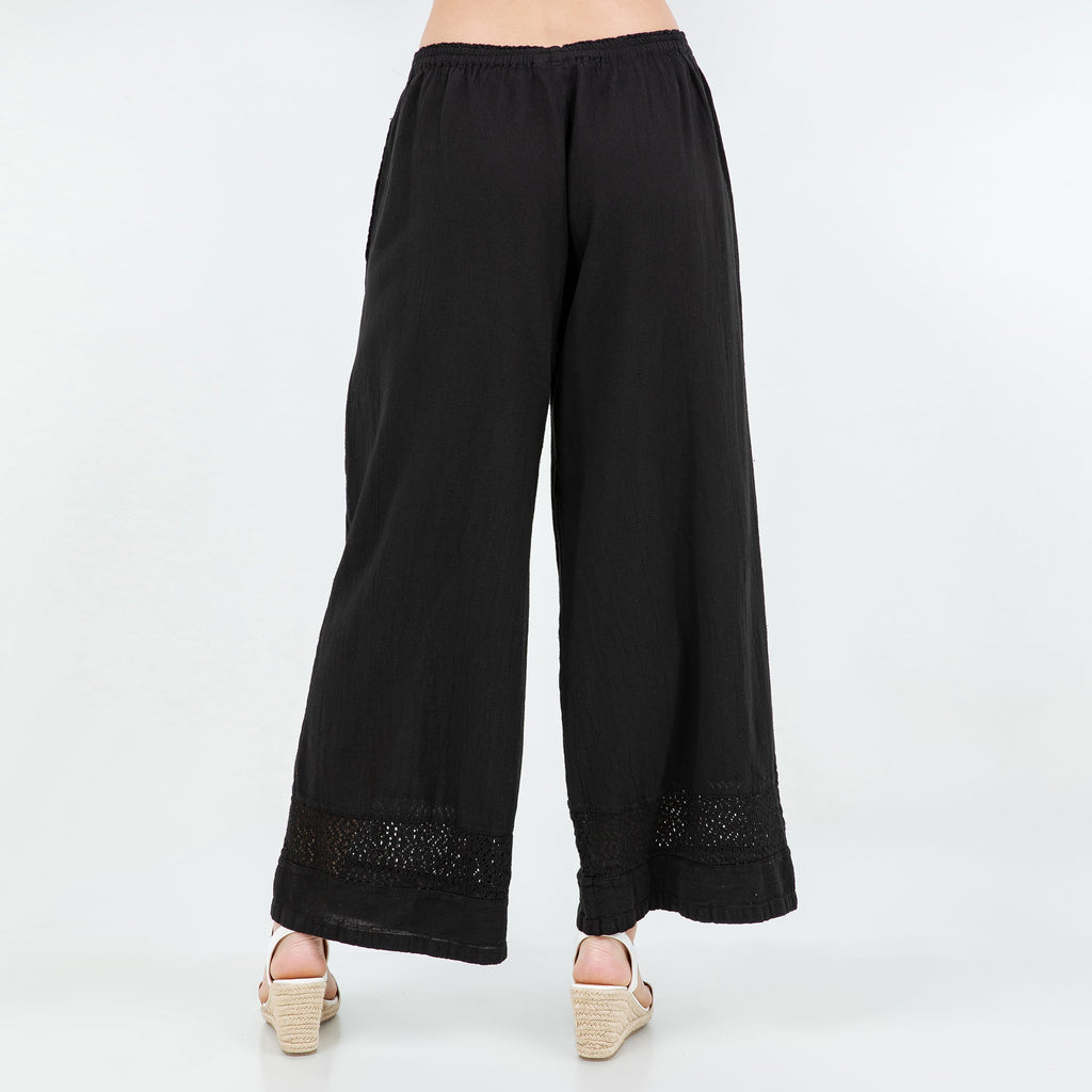 Black cotton gauze wide-leg pants with elastic waistband and lace-trim cuffs