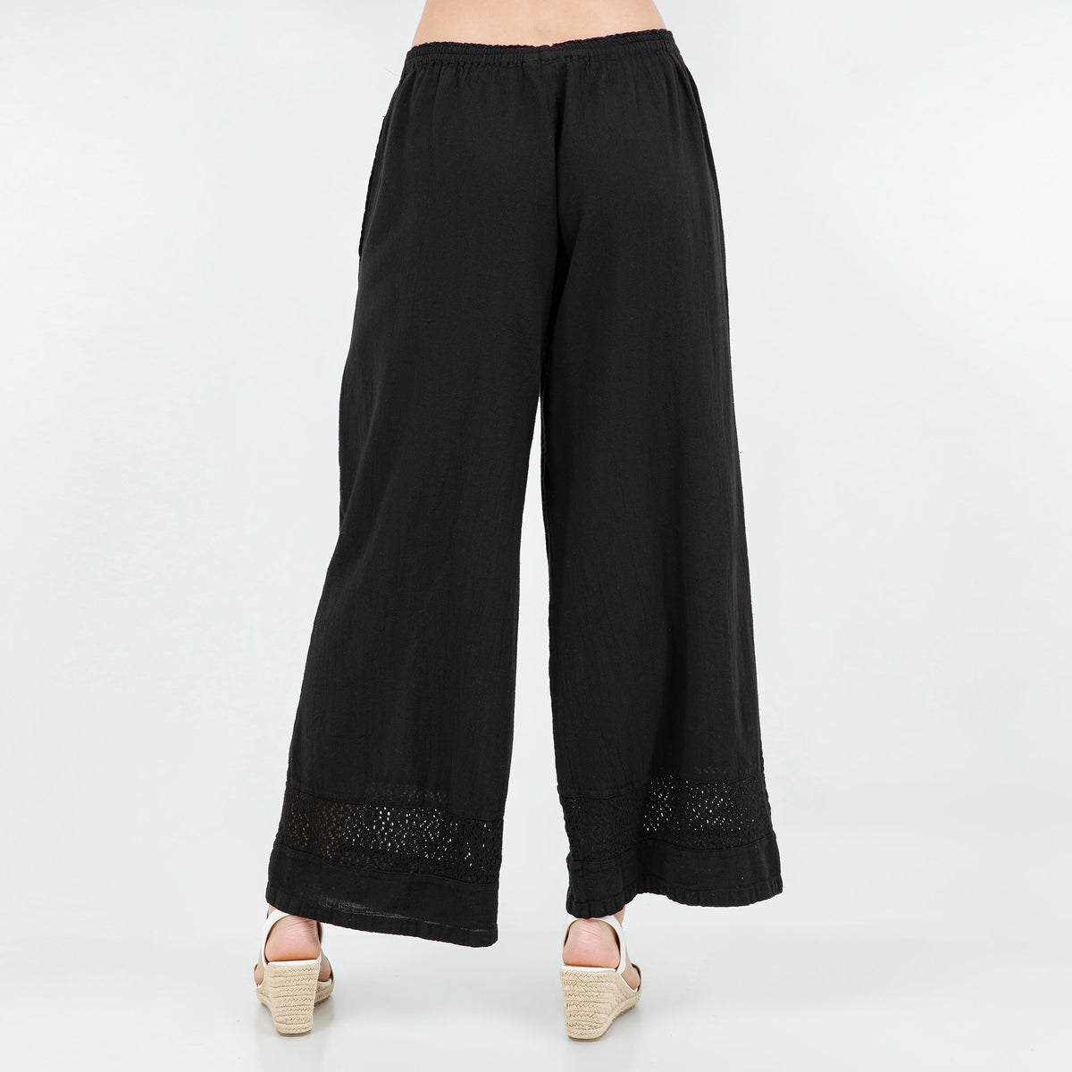 Black cotton gauze wide-leg pants with elastic waistband and lace-trim cuffs