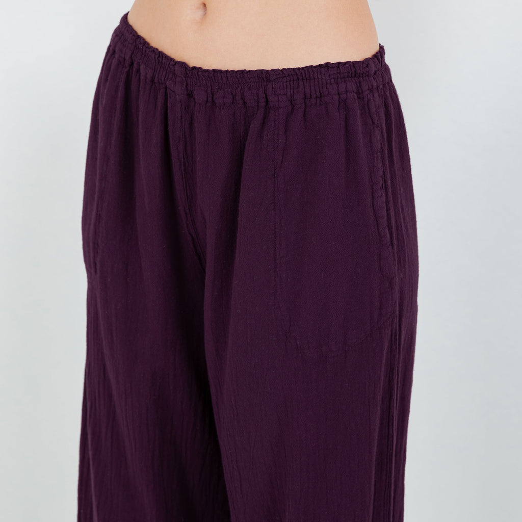 Eggplant purple cotton gauze pull-on pants with elastic waistband and relaxed wide legs