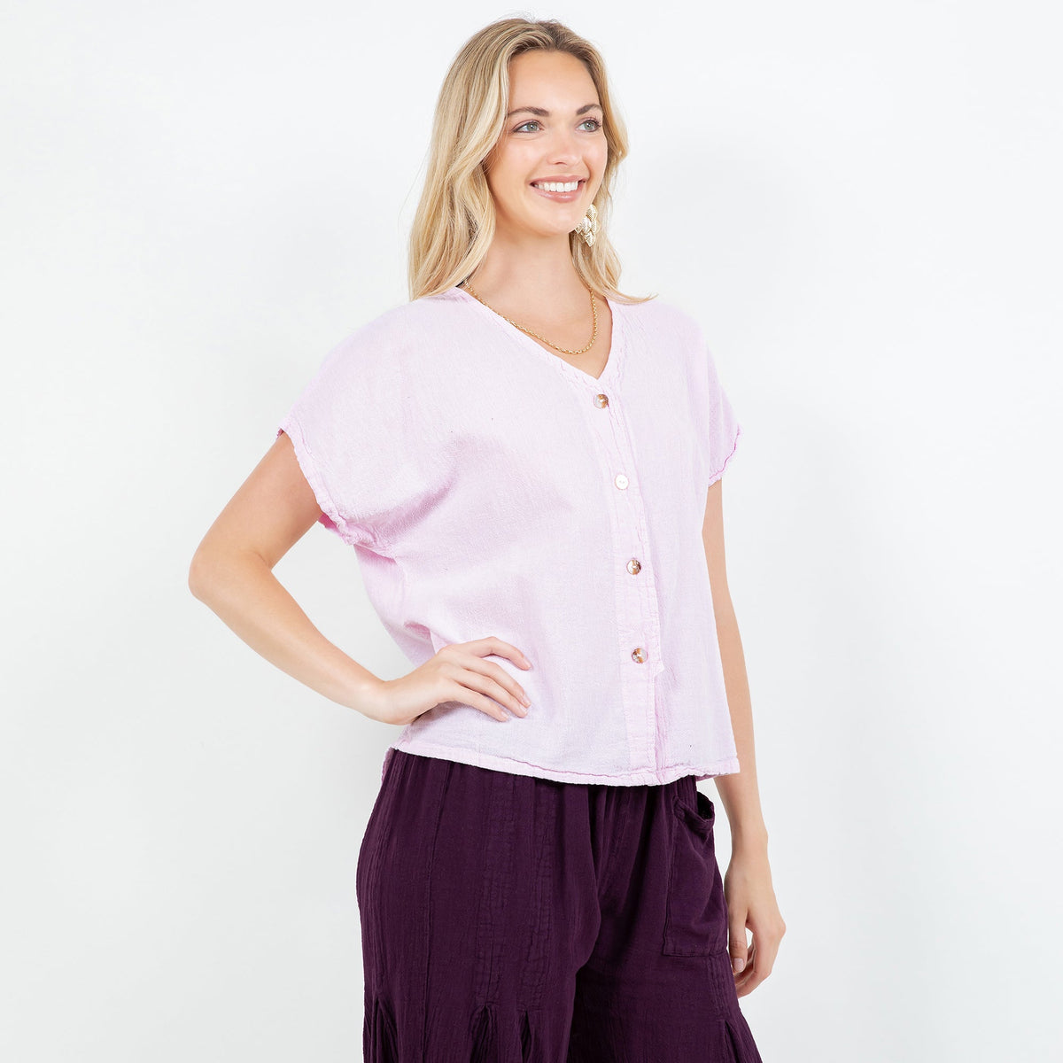 Lavender cotton gauze top with V-neck button-front and relaxed fit hem
