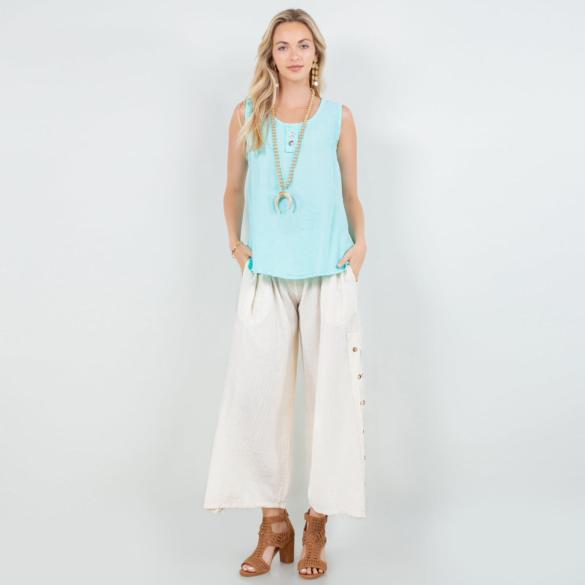 Turquoise sleeveless cotton gauze tunic top with scoop neck and side slits