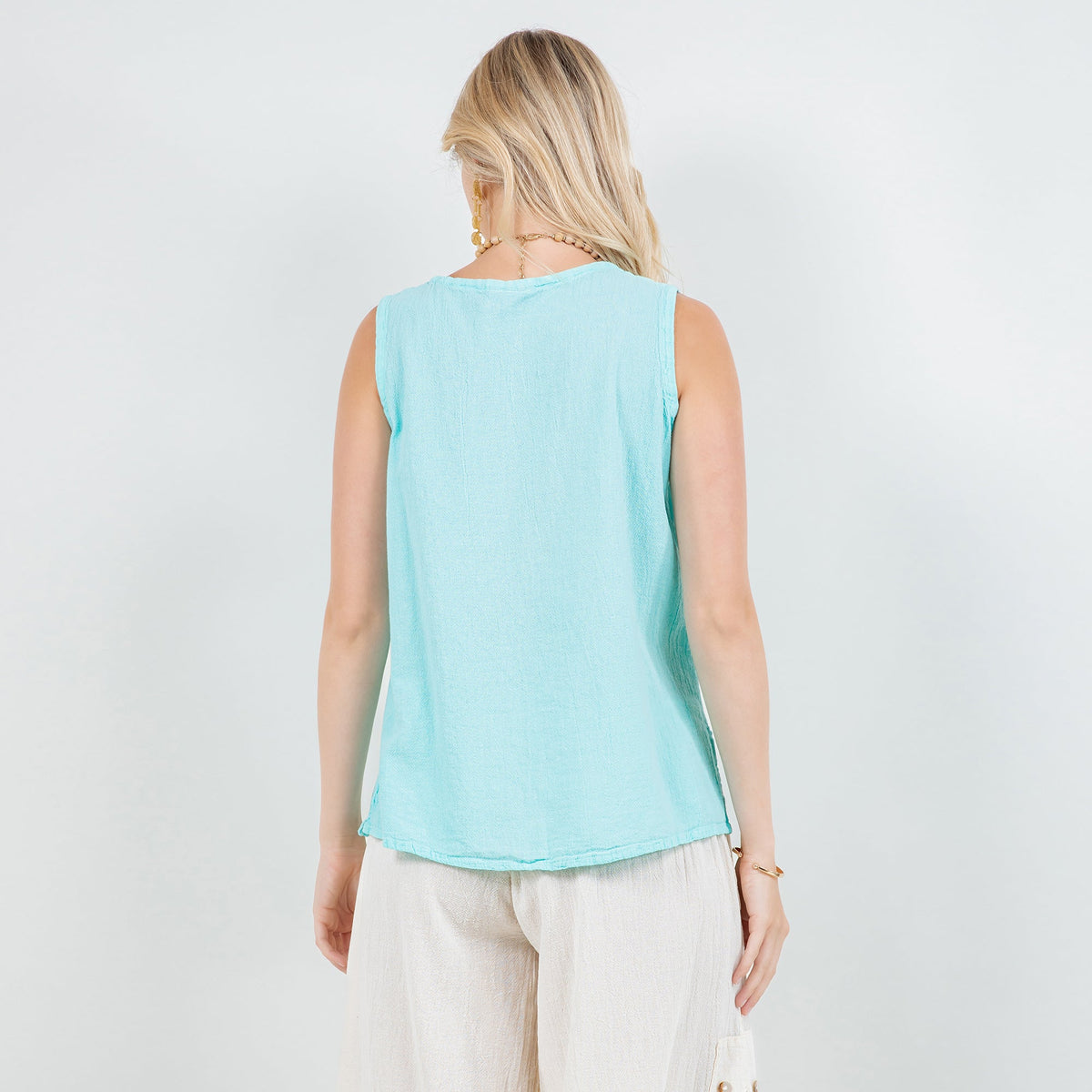 Women's cotton gauze sleeveless top, light blue back view with curved hem
