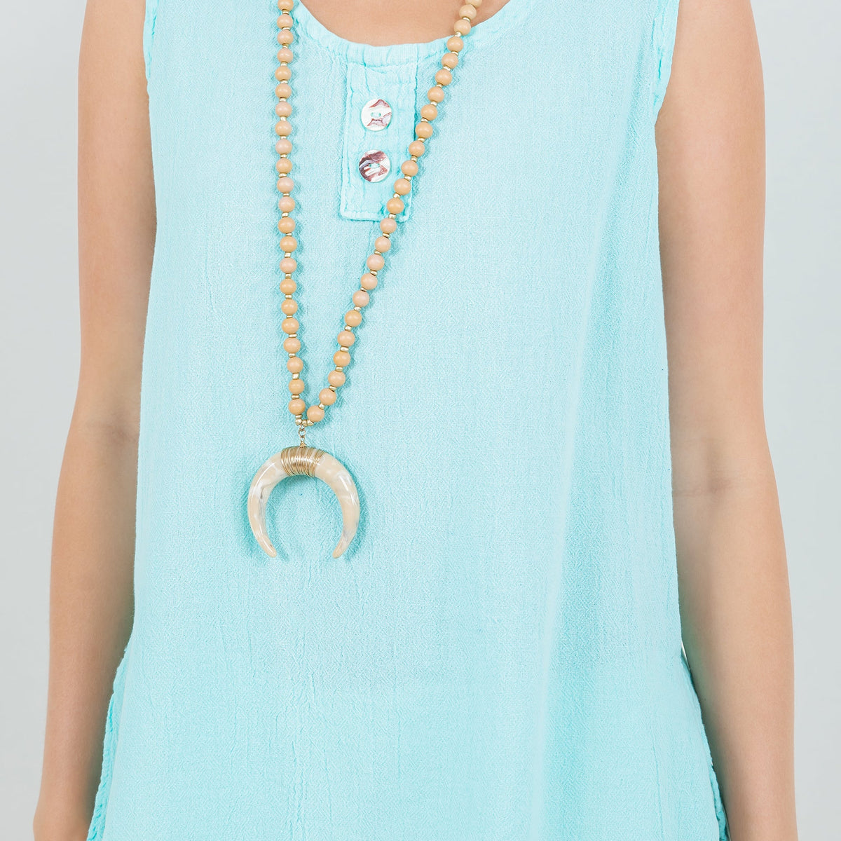 Women's cotton gauze sleeveless top in light blue, round neck with button placket