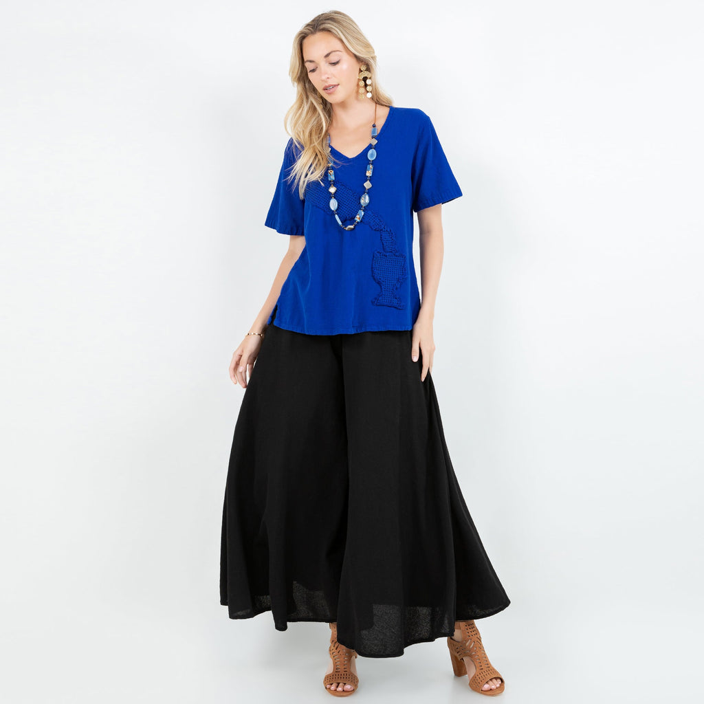 Black cotton gauze Blanche pants with elastic waist and drapey wide-leg silhouette