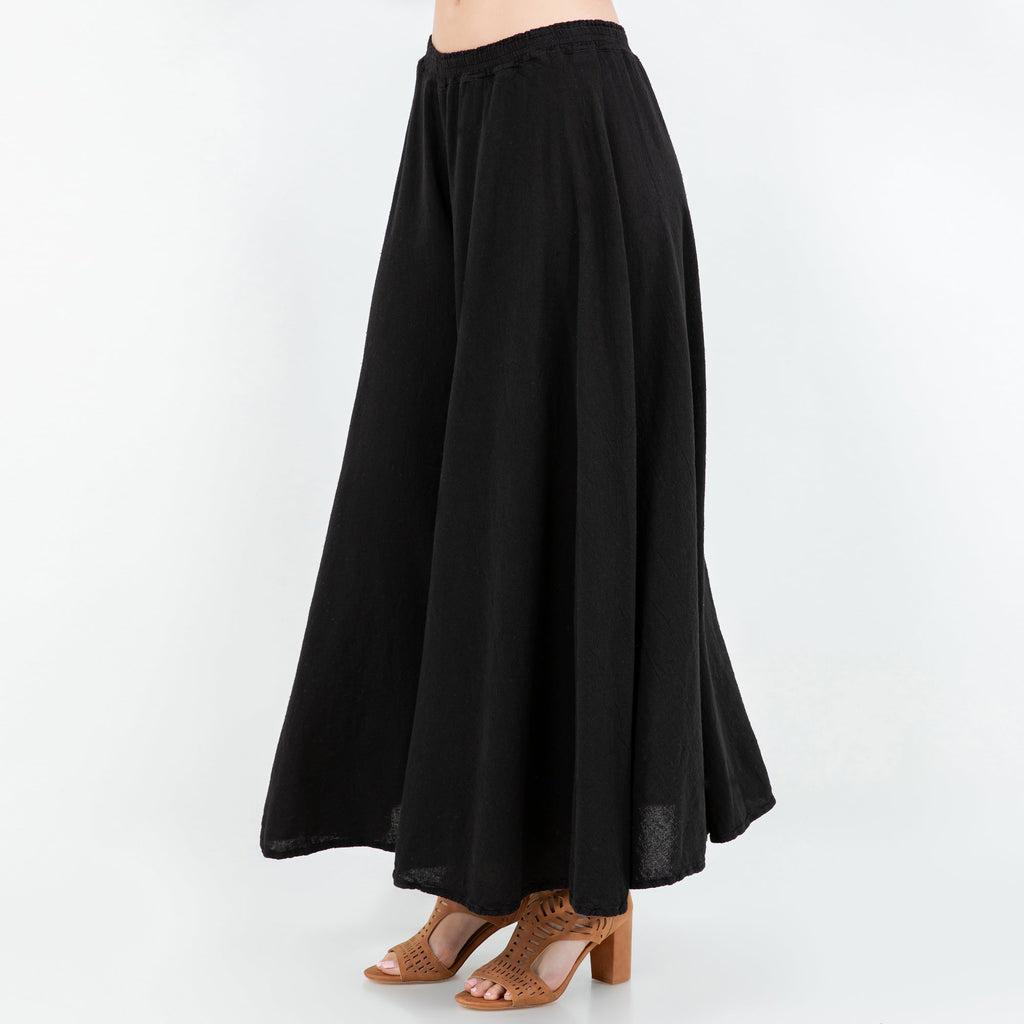 Black 100% cotton gauze pants with elastic waist and wide flowy wide-leg silhouette