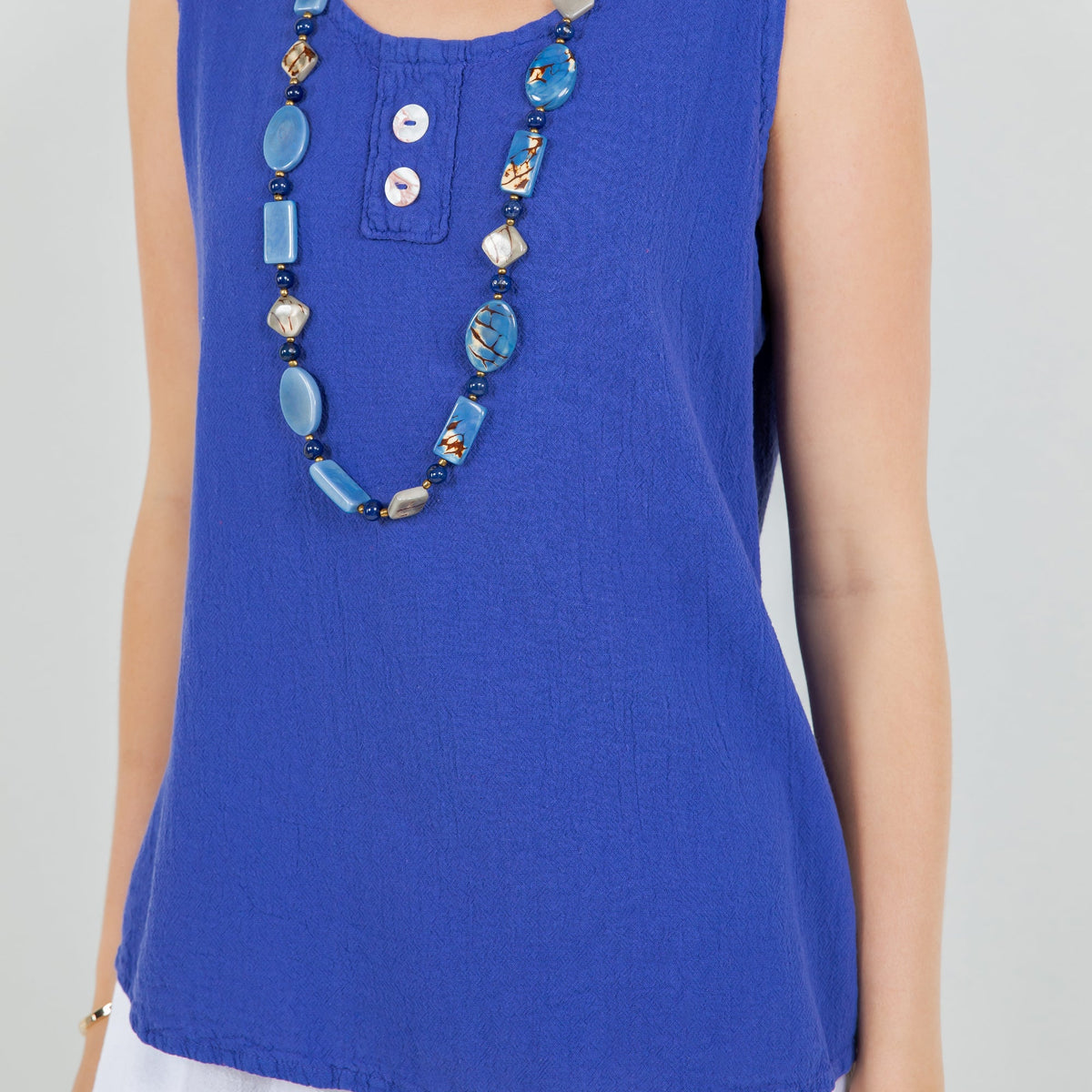 Women's cotton gauze Anne top, blue close-up with three-button placket detail.