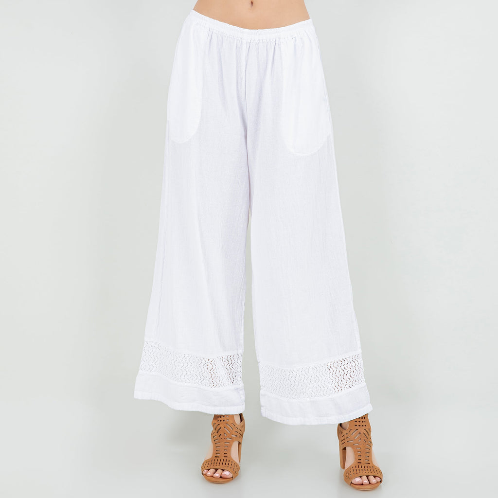 White cotton gauze wide-leg pants with elastic waistband and lace-trimmed hem